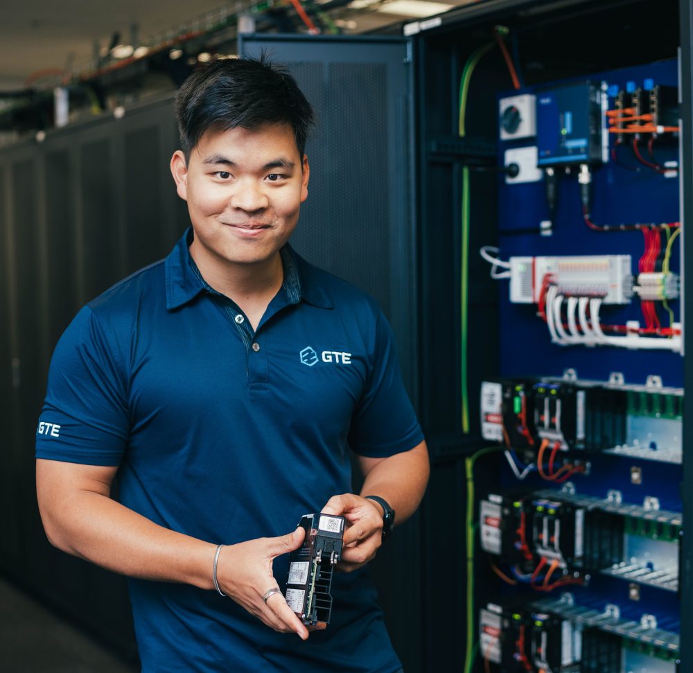 GTE engineer with industrial network hardware in the test laboratory